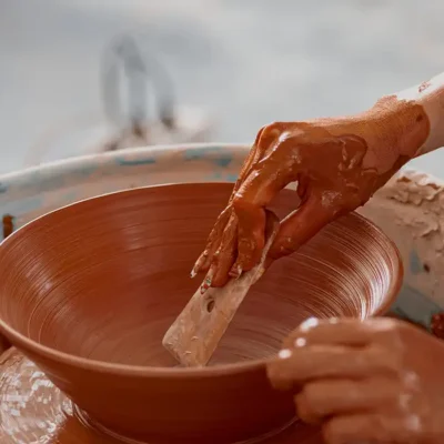 Craftsmanship in Tuscany - hands working terracotta