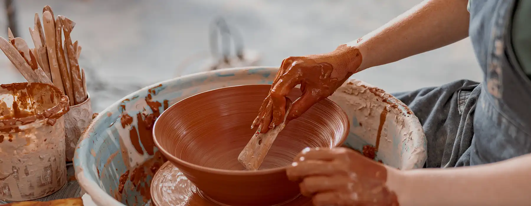 Craftsmanship in Tuscany - hands working terracotta