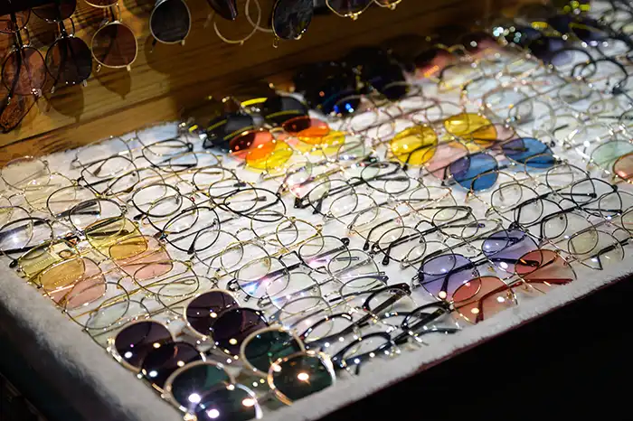 Display stand with vintage eyeglasses and sunglasses