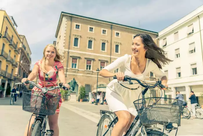 Two girls cycling outdoors