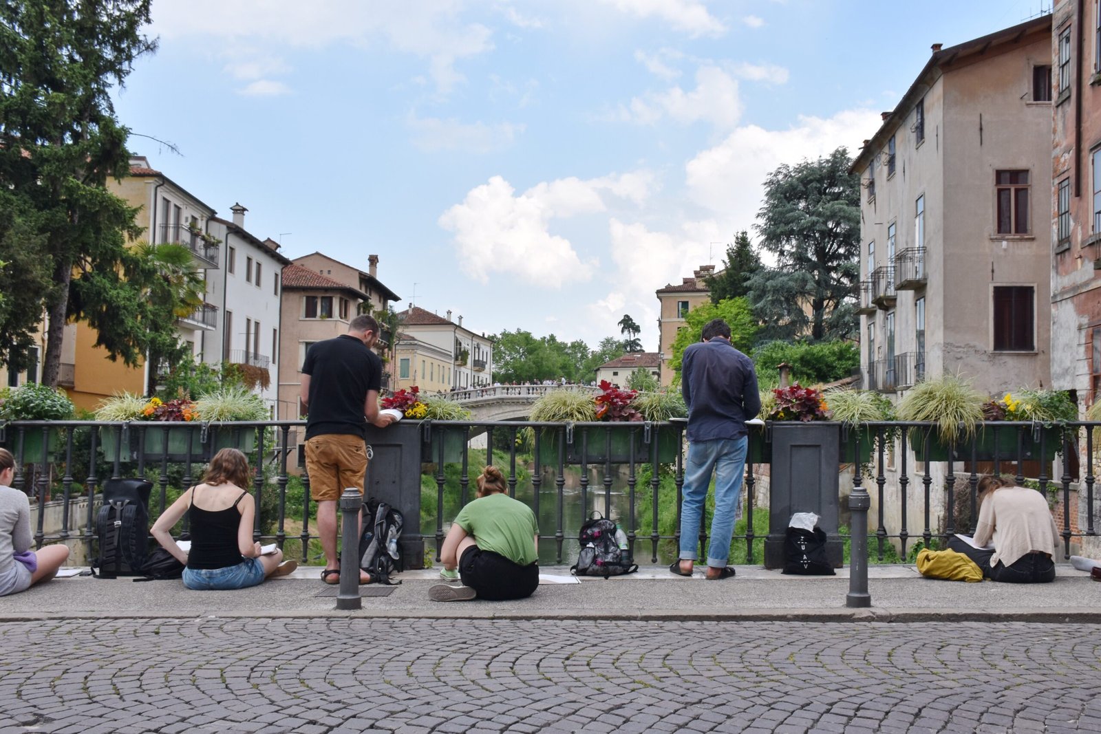 Young artists on the bridge of Vicenza Italy