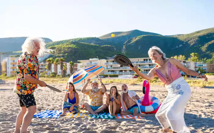 senior friends at the beach