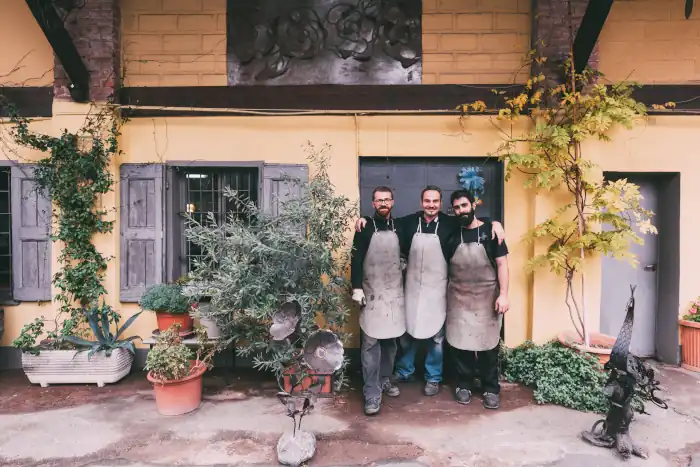 Metalworkers outside forge