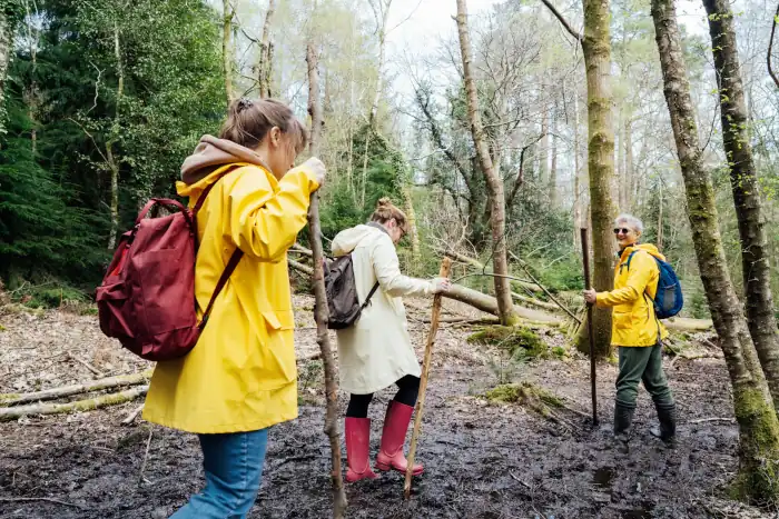 Discover Italy’s Fall Traditions: Everyday Rituals That Capture the Heart of Autumn 9 group of friends walking through muddy trail