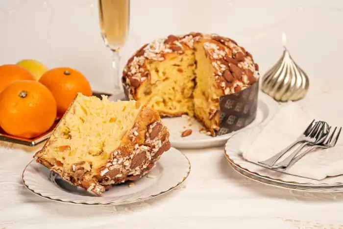 Festive table setting with sliced panettone orange