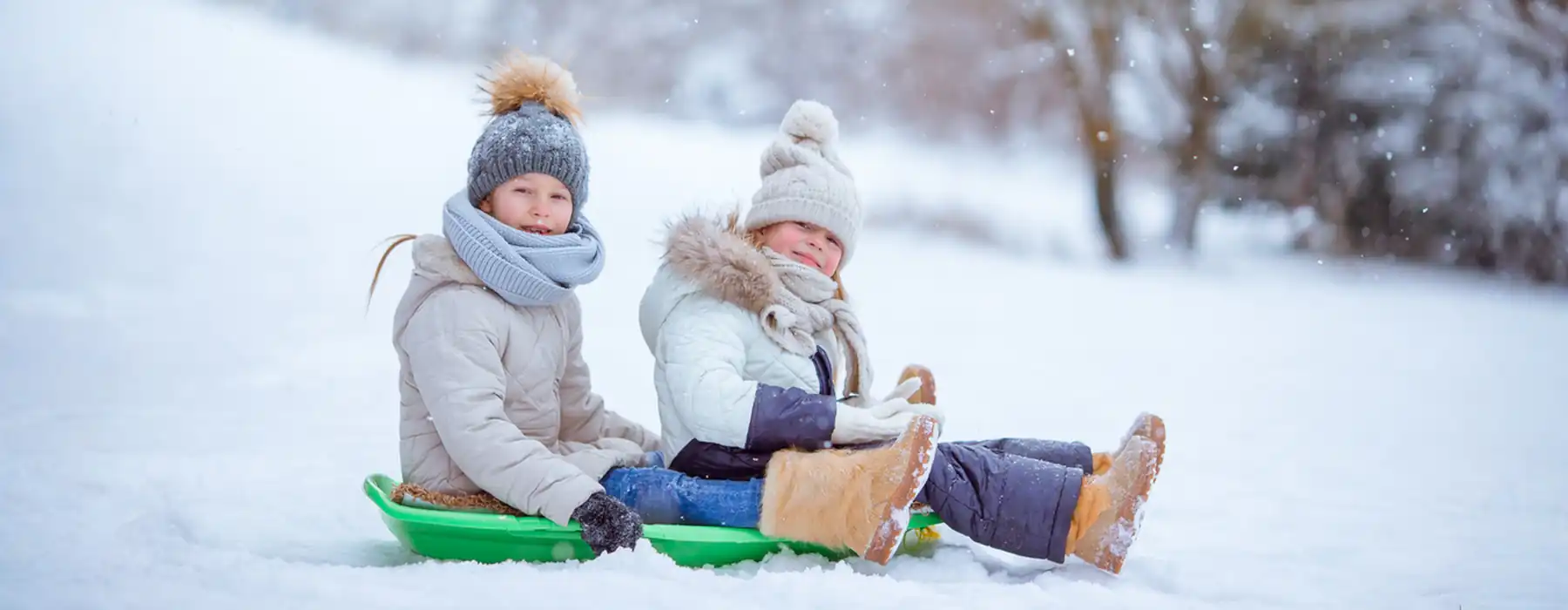 The Joy of Winter Fun in Italy Movie Theaters, Games, and Cozy Escapes, teenagers girls sledding in ther park