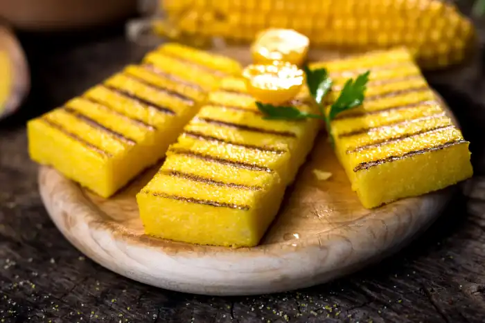 grilled polenta on old wooden cutter