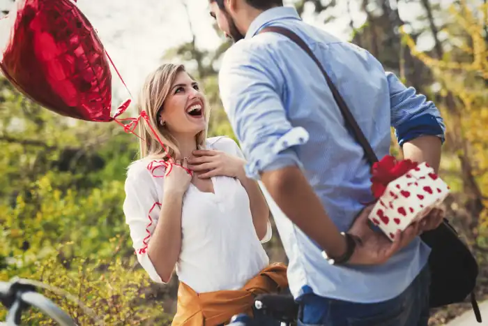 Charming Italian Kitchen: Chocolate Kiss, Heart Shaped Ravioli and Elegant Linens for Valentine’s Day 8 man giving surprise gift as present to his lovely girl friend