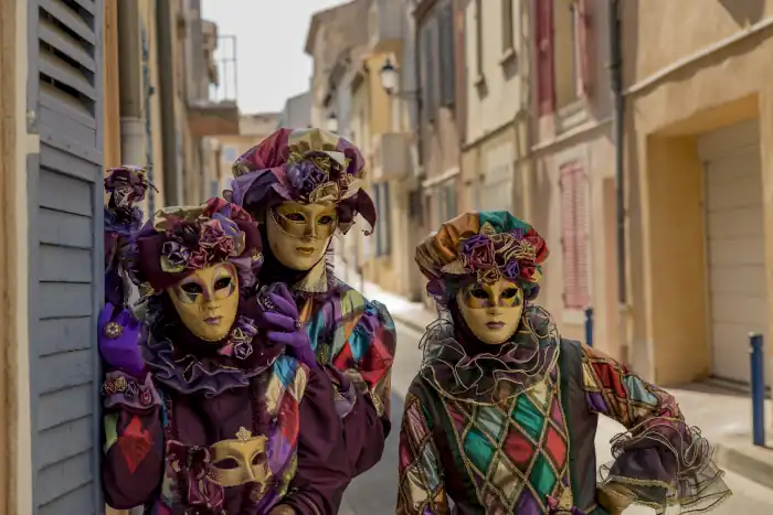 people wearing colorful masks and costumes