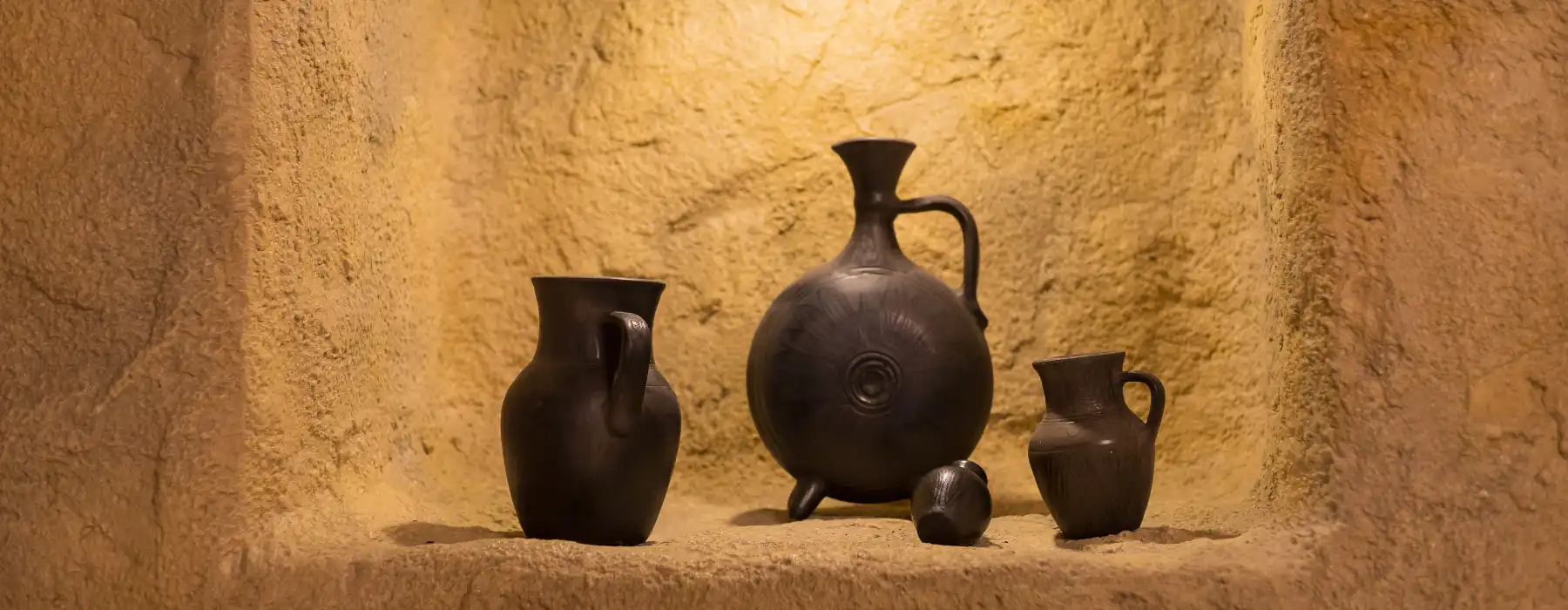 A Taste of Italian Spring Cheese, Ceramics, and Travel Treasures, antique potteryin a stone niche